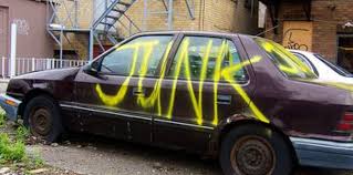 A maroon car with the word